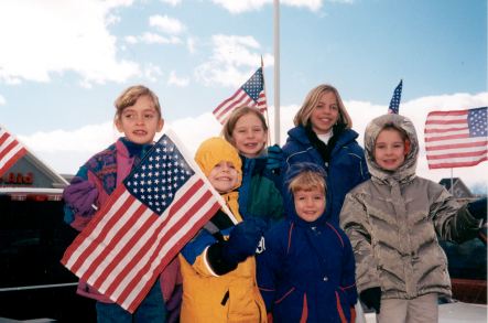 The Nosack and Bollinger kids waving American flags